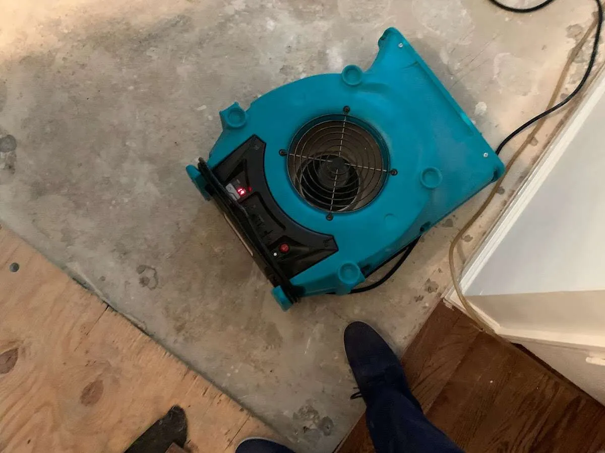Air mover drying subfloor during Leak Detection & Repair in Henryetta